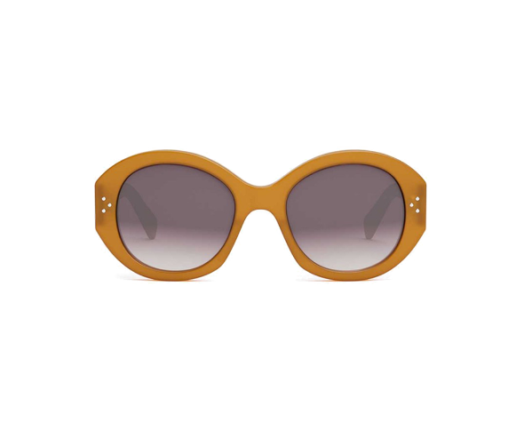 Lunettes de soleil CL40240I de la marque Celine, monture pour femmes, avec un design oversized rond fabriquée en acétate jaune disponible dans les boutiques Atelier Lou Paris